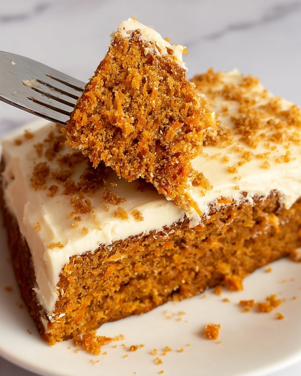 A slice of two-layer carrot cake sits on a white rectangular plate against a white marbled surface. The bottom and top layers are a moist, crumbly brown carrot cake with visible bits of grated carrot and nuts, while the middle and top layers are thick, creamy white frosting, slightly textured and spread unevenly. Some crumbs cling to the frosting, emphasizing its softness. A fork holds a small piece of cake with both cake and frosting visible, placed in the foreground on the right side of the plate. Photo taken with an iphone --ar 4:5 --v 7