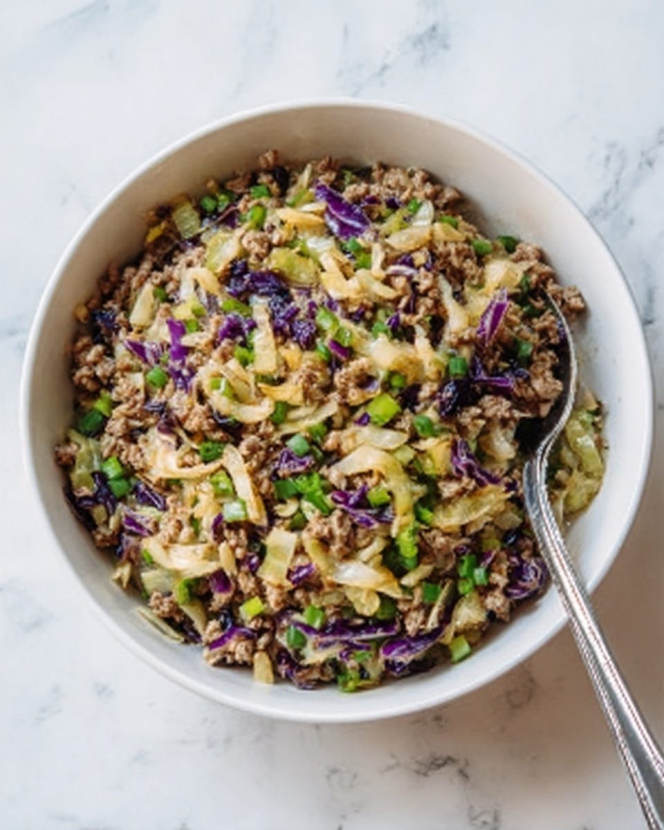 A close-up of a bowl filled with a stir-fry mix showing small pieces of cooked chicken mixed with chopped vegetables like light green cabbage, bright green onions, bits of purple cabbage, and small orange carrot pieces. The chicken pieces are light brown and look soft, blending with the translucent and slightly glossy cooked vegetables. A pair of black chopsticks is picking up some of the stir-fry from the white bowl, which sits on a white marbled surface. The mix has a textured look with shiny, cooked bits throughout. Photo taken with an iphone --ar 4:5 --v 7